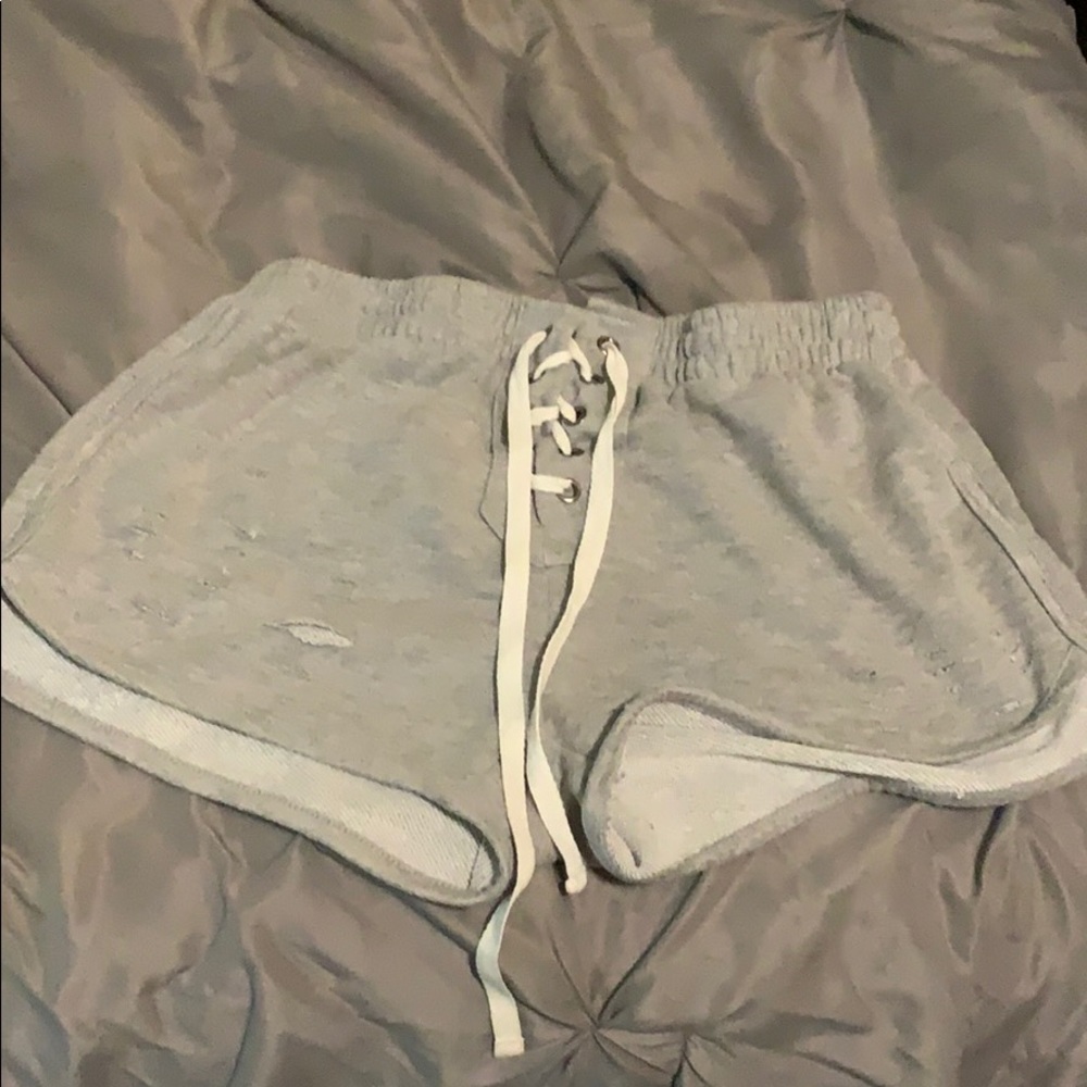 Grey shorts with crossed strings